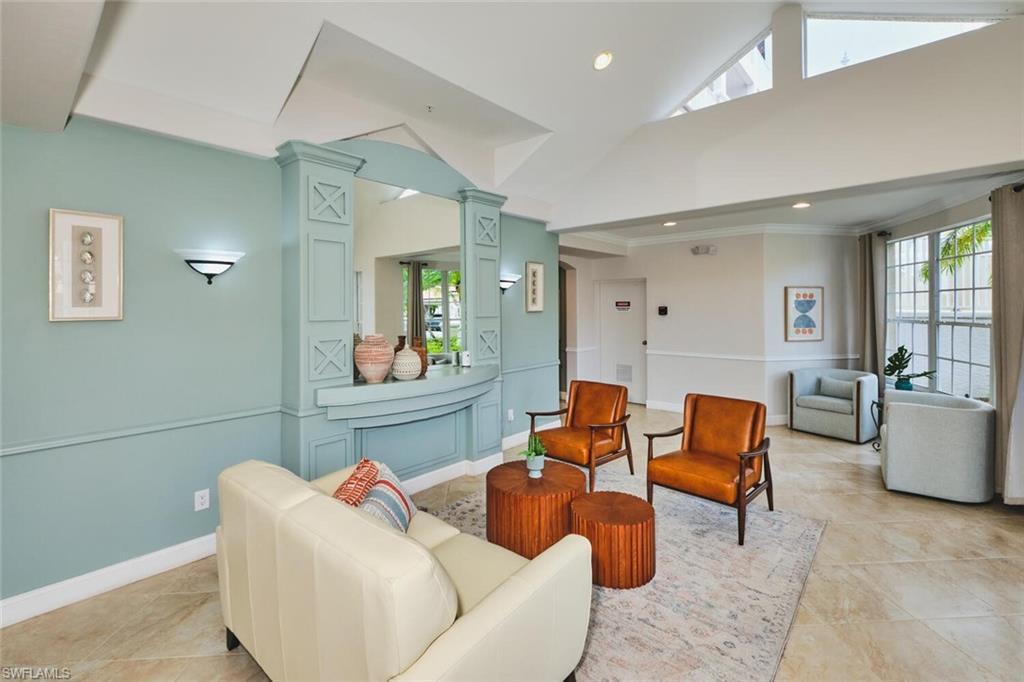 Image 4: Sitting room featuring high vaulted ceiling, plenty of natural light, recessed lighting, light tile patterned floors, and ornamental molding