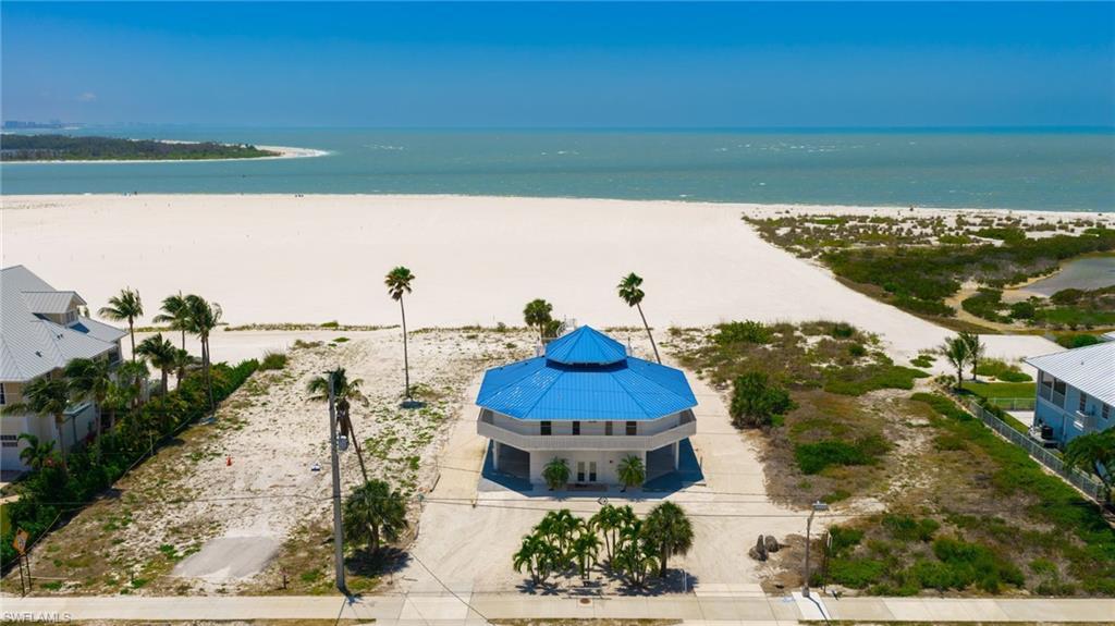 Image 2: Octagonal coastal residence with a vibrant blue multi-tiered roof - Virtually Edited Image