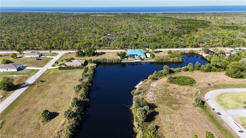 Image 2: View of property location featuring a nearby body of water