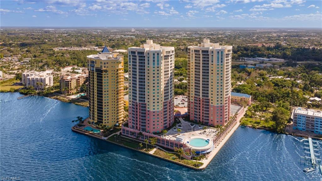 Image 3: Waterfront high-rise complex featuring multiple towers with extensive water frontage