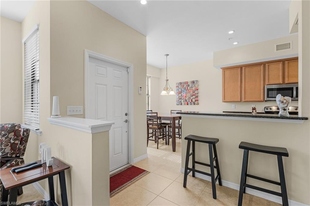 Image 4: Kitchen featuring a wealth of natural light, stainless steel appliances, and kitchen peninsula