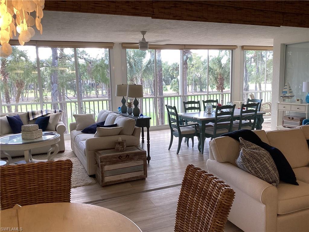 Image 4: Enclosed lanai  with wood finished floors