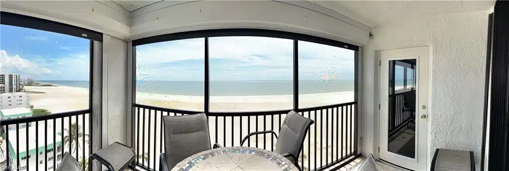 Image 1: Panoramic- Primary bedroom door access, 1oth floor view, electric shutters