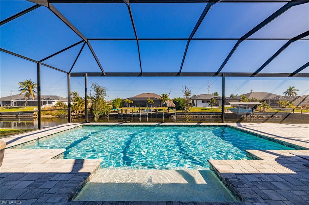 Image 2: Outdoor pool with a residential view, a sunroom, a lanai, and a patio