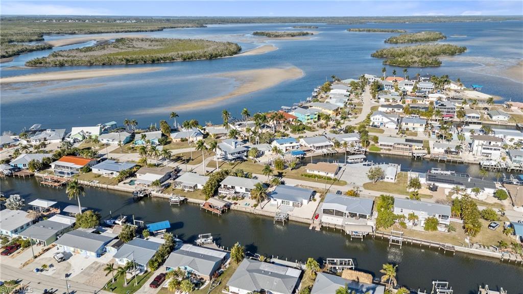 Image 3: Aerial view of property's location with nearby suburban area and a nearby body of water