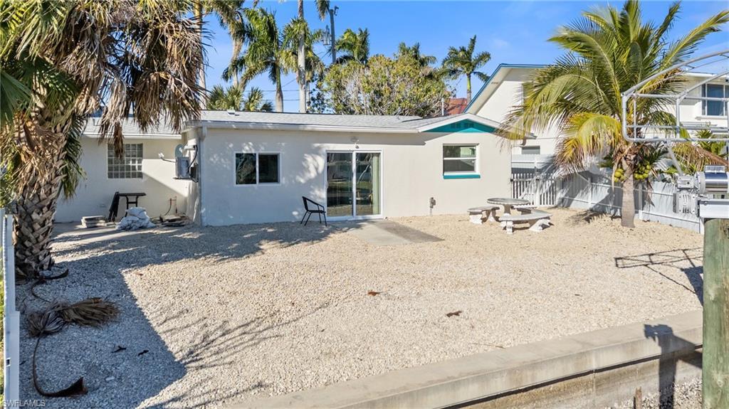 Image 4: Back of property with stucco siding