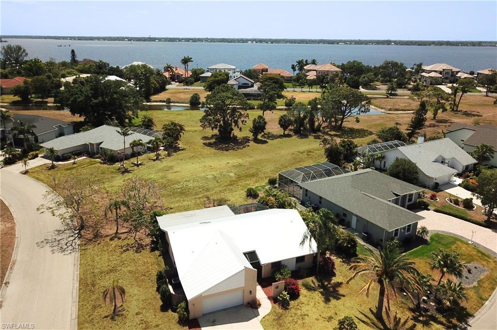 Image 2: Birds eye view of property with a residential view and a water view
