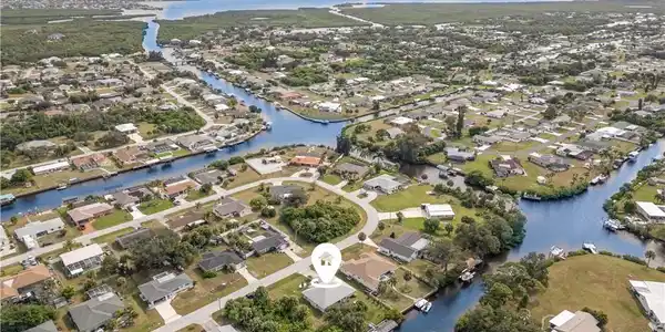 Image 2: View of property location with nearby suburban area and a nearby body of water