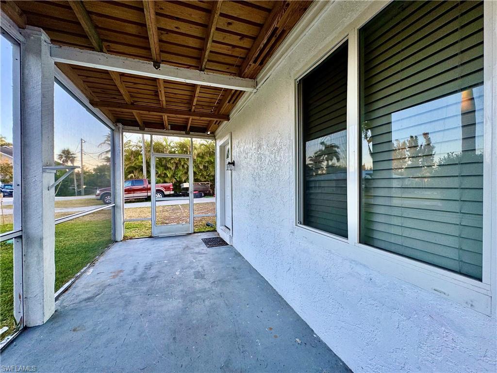 Image 4: View of patio / terrace featuring a sunroom