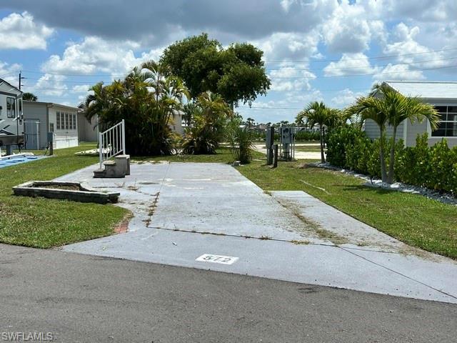 Image 1: Looking straight from the road to the lot.