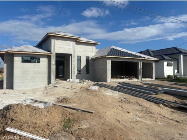 Image 3: View of front facade with an attached garage