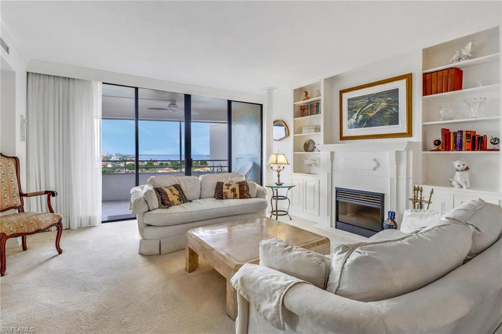 Image 2: Living room featuring light carpet and built in features