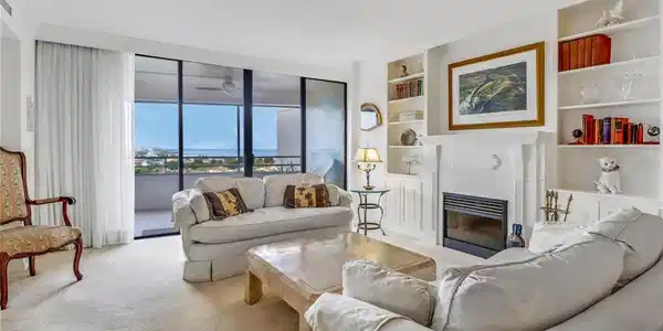 Image 2: Living room featuring light carpet and built in features