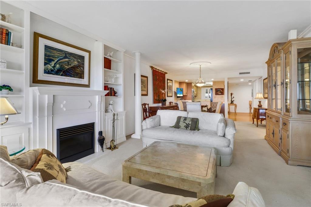 Image 3: Carpeted living room featuring built in features