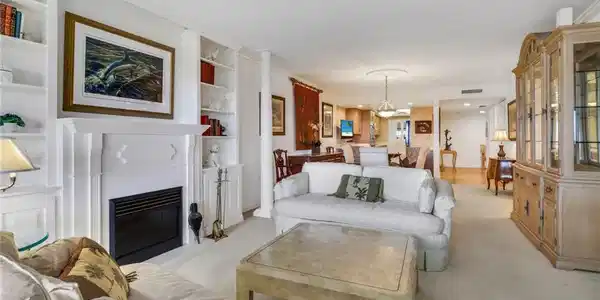 Image 3: Carpeted living room featuring built in features