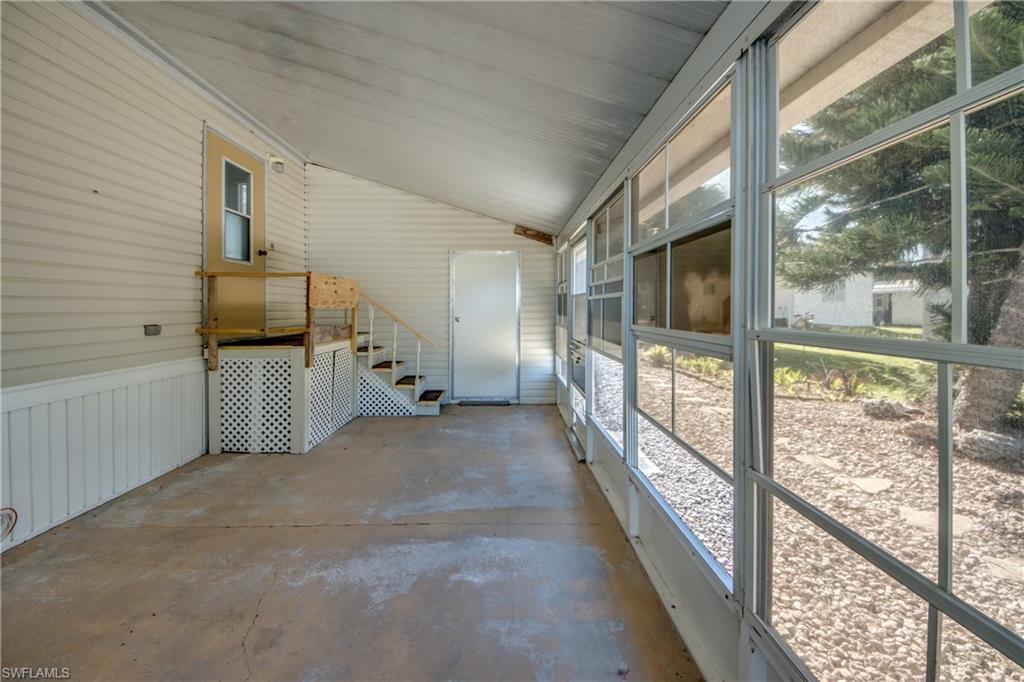 Image 4: Enclosed sunroom with expansive windows, providing exterior views