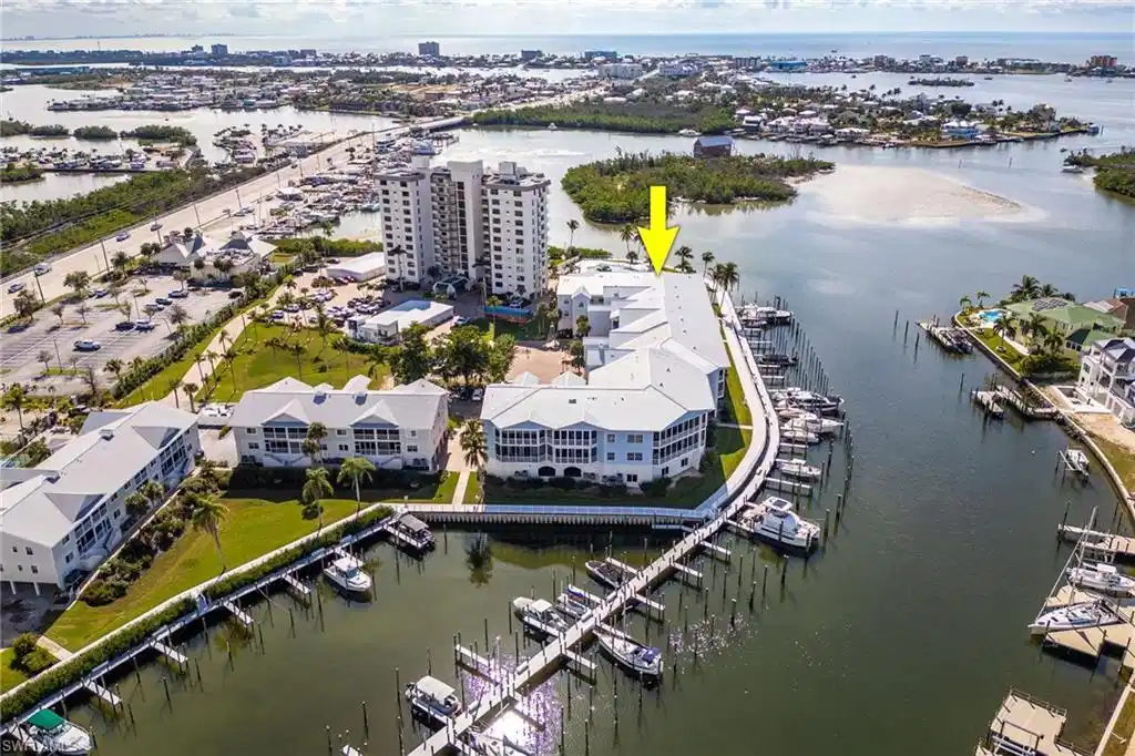 Image 1: Bird's eye view of a marina and a nearby body of water