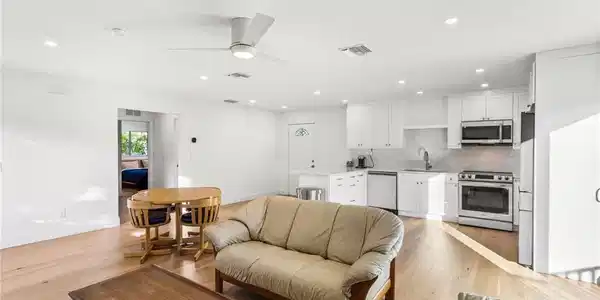 Image 2: Living room featuring recessed lighting, ceiling fan, and light wood flooring