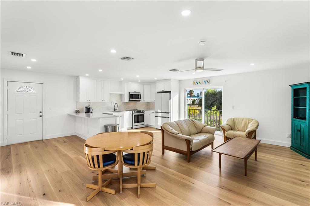 Image 3: Dining area featuring recessed lighting, a ceiling fan, and light wood floors