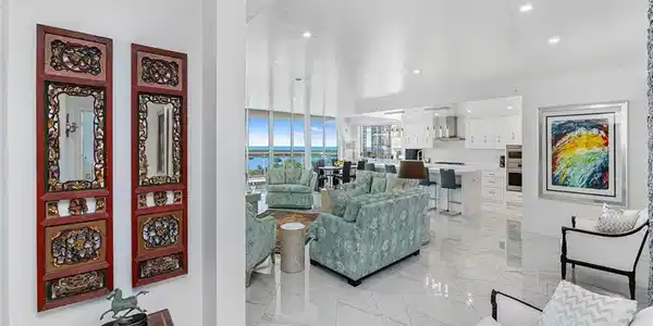Image 4: Expansive living room with bright white floors.