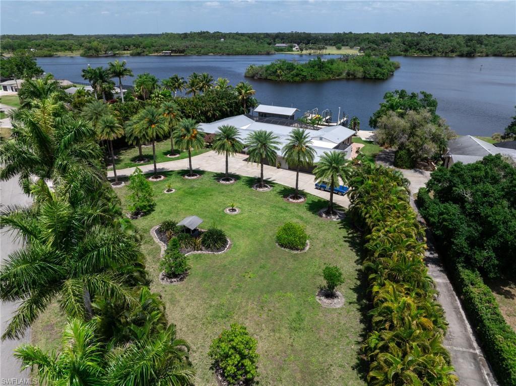 Image 1: Birds eye view of property with a water view