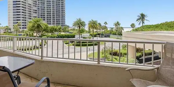 Image 2: Tiled balcony with a metal railing