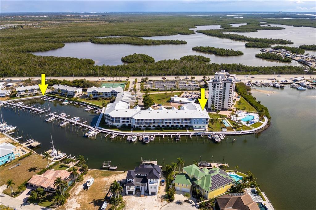 Image 4: View of property location with a marina and a nearby body of water