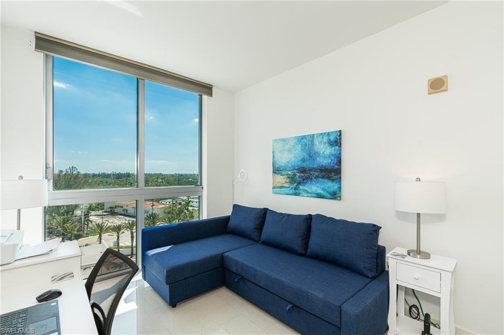 Image 3: Den with floor to ceiling windows