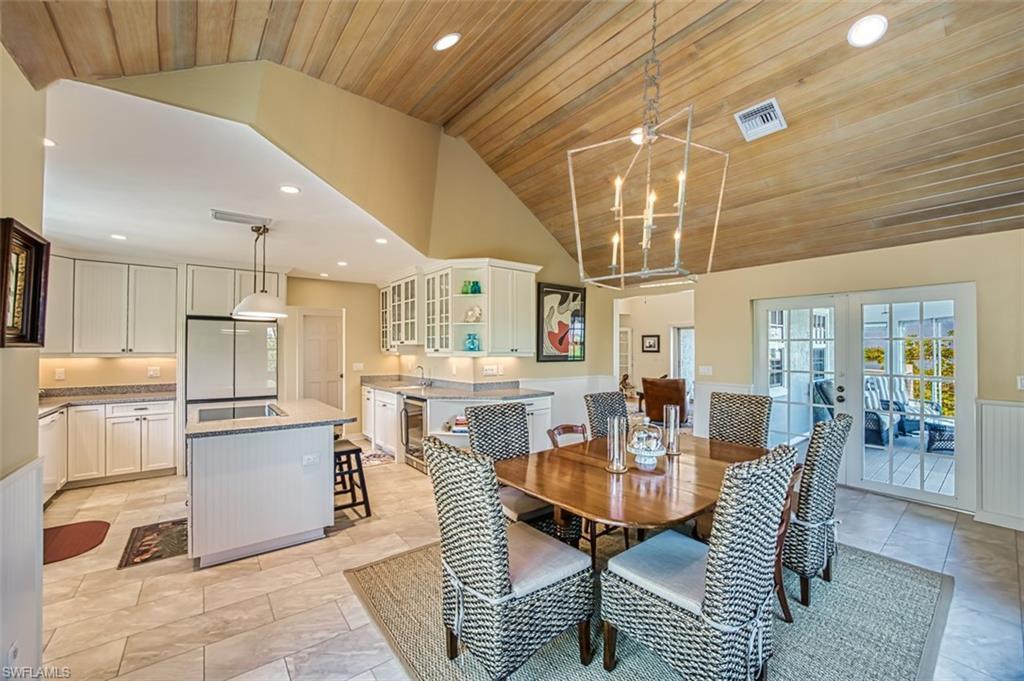 Image 2: Dining Space And Kitchen With Access To Enclosed Lanai