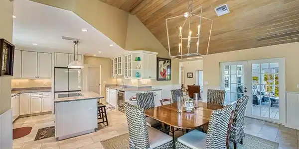 Image 2: Dining Space And Kitchen With Access To Enclosed Lanai