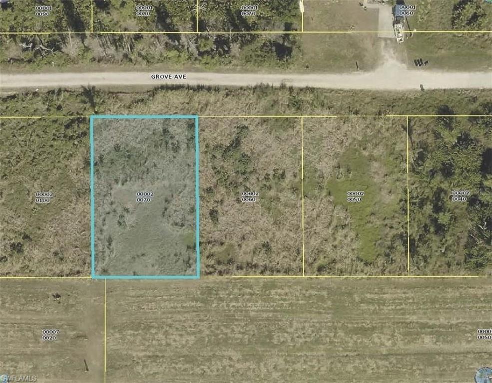 Image 1: Aerial view of property's location featuring property parcel outlined