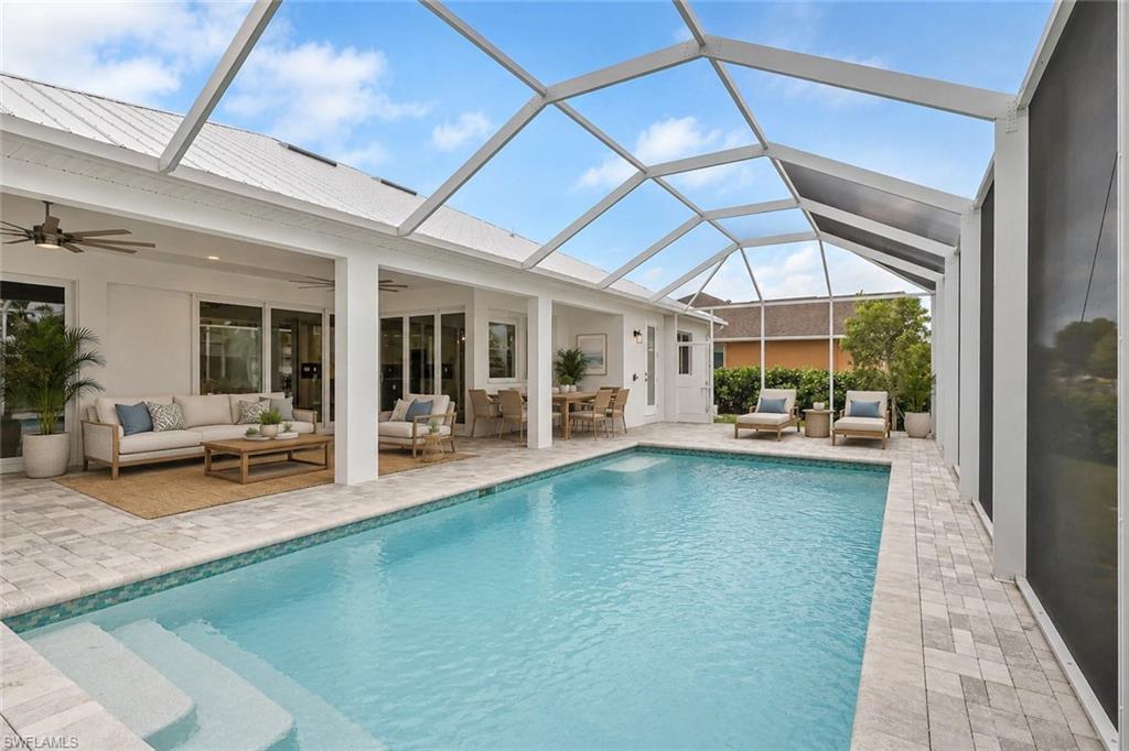 Image 4: virtually staged, large 13' by 27' heated pool on 20' by 46" lanai