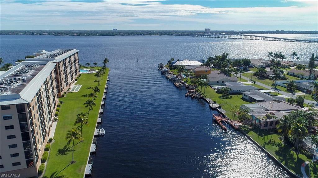 Image 2: Bird's eye view of a large body of water and a notable bridge