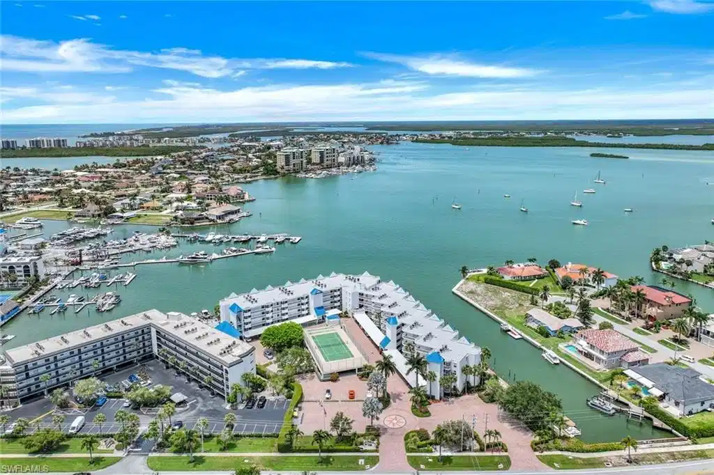Image 1: View of urban area featuring a nearby body of water