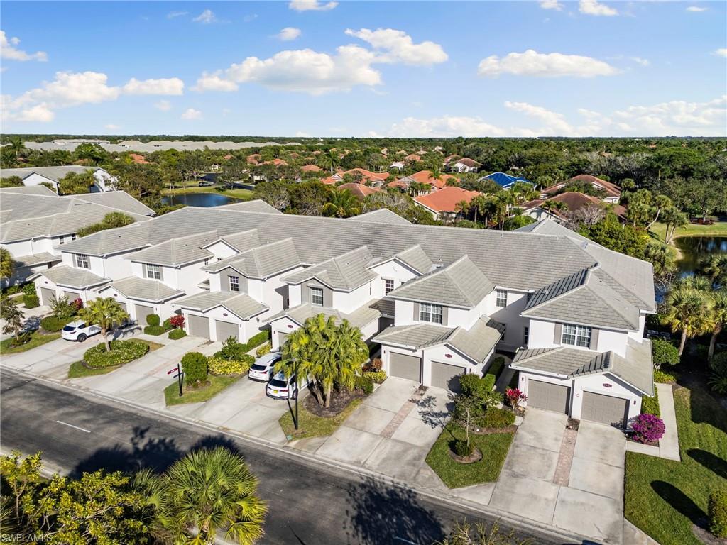Image 2: Aerial perspective of suburban area with a nearby body of water