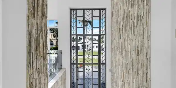 Image 3: Tiffany stainless-steel front door showcasing modern elegance and craftsmanship.