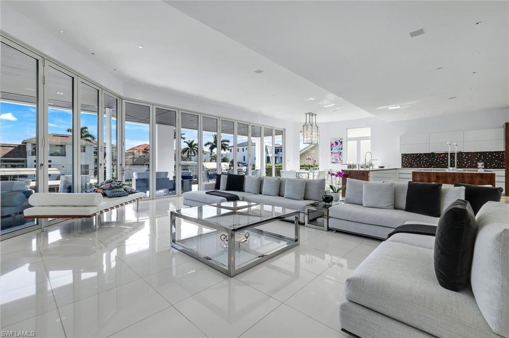 Image 4: Expansive living area with Thassos marble floors, Solar Innovations glass doors