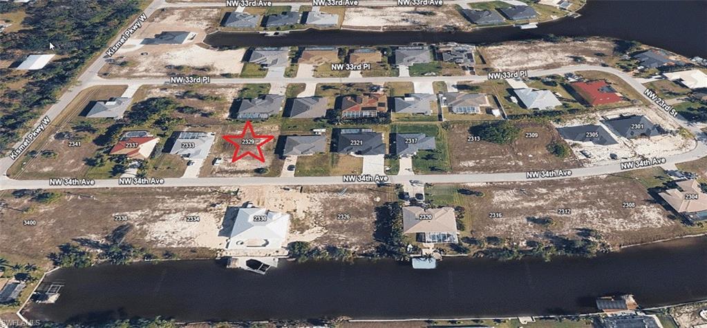 Image 3: Aerial view of the property and the surrounding neighborhood.
