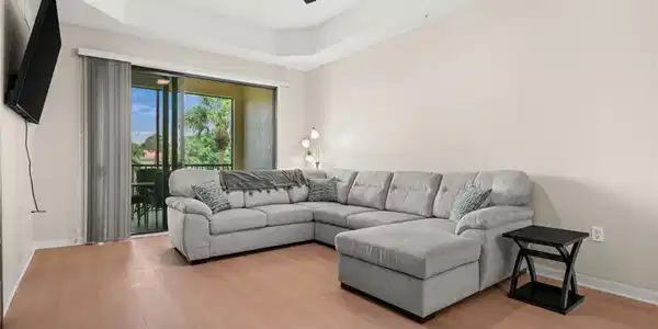 Image 4: The living room is spacious and so inviting!