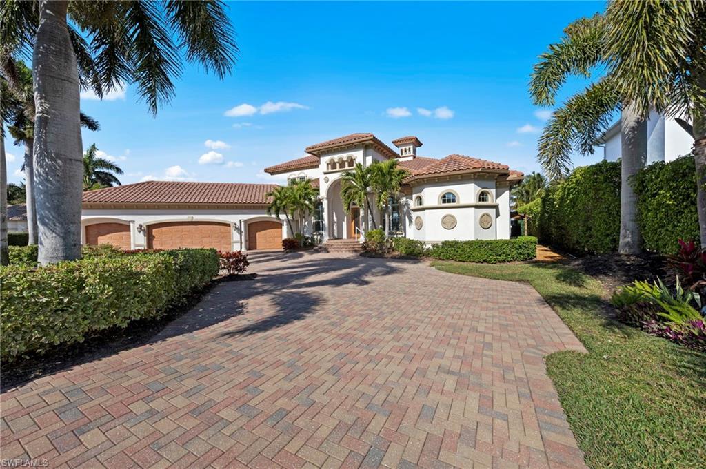 Image 4: Front elevation with circular driveway and 4 car garage