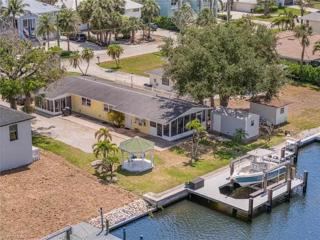 Image 1: Split into 2 units with screened porches! Dedicated storage shed & Decorative Gazebo!