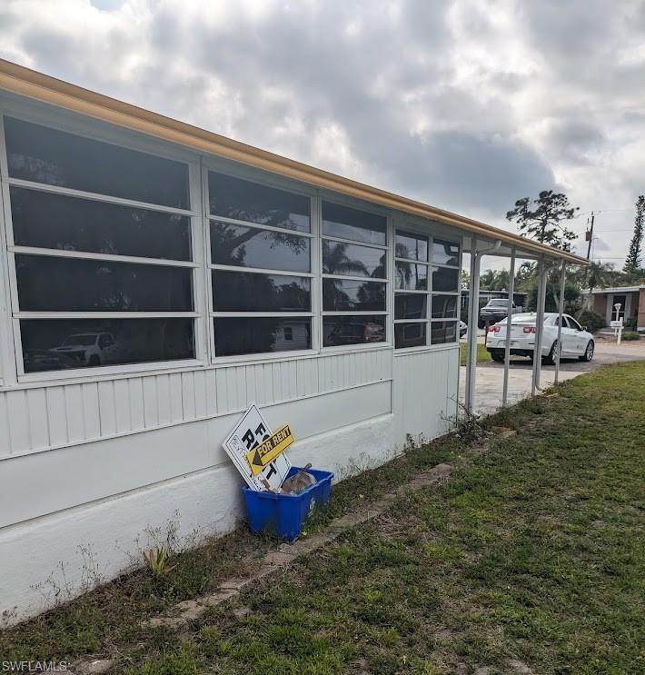 Image 4: View of property exterior with a yard