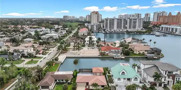 Image 4: Aerial view of a nearby body of water and city skyline