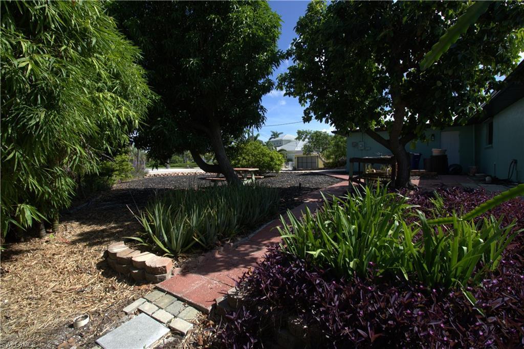 Image 4: View of property exterior featuring stucco siding
