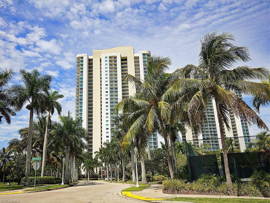 Image 1: High-rise building exterior featuring a curved architectural element and numerous balconies