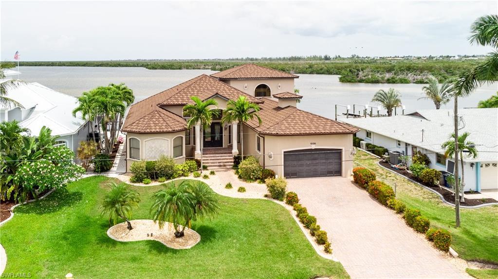 Image 1: Multi-story waterfront with quick boating access
