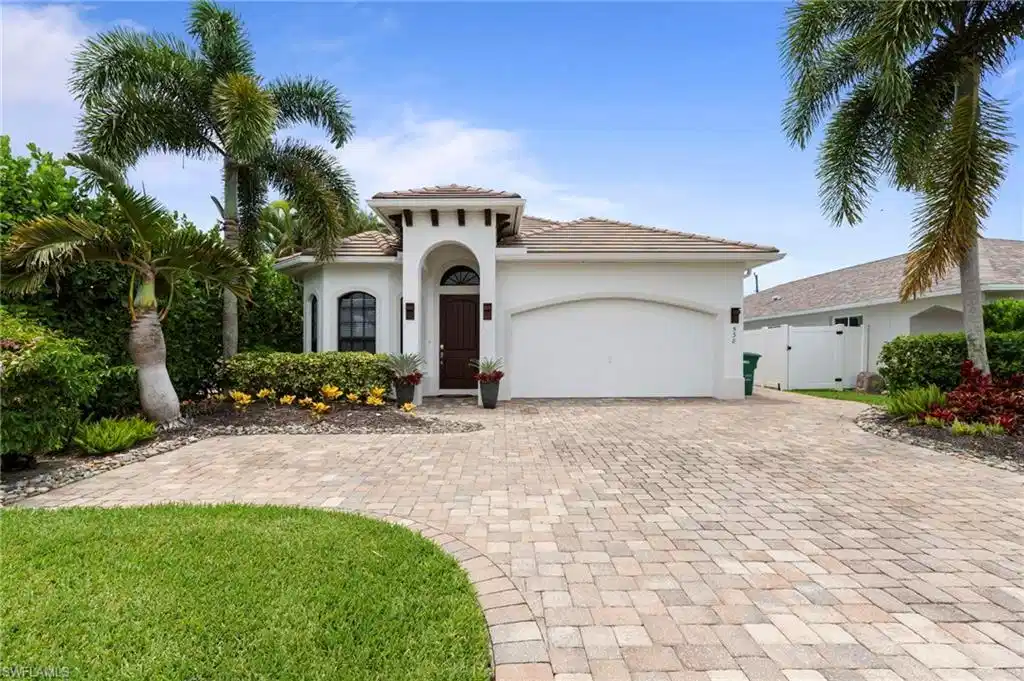 Image 1: Mediterranean-inspired exterior with a barrel tile roof