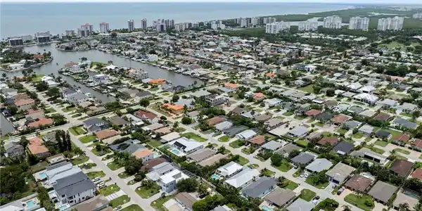 Image 3: Aerial perspective showcasing a residential community with numerous properties