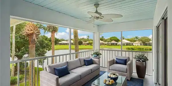 Image 4: Sunroom featuring a ceiling fan, outdoor lounge area, a residential view, and a water view