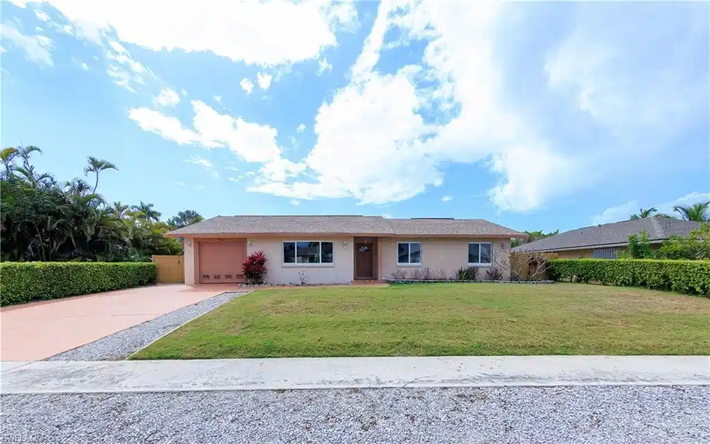 Image 1: Ranch-style house featuring concrete driveway, stucco siding, and an attached garage